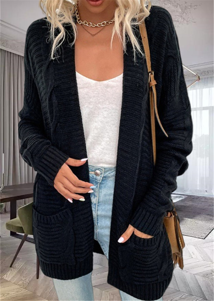 Damernas grovstickad cardigan med strukturerade ärmar och djupa fickor Mirla-Eva Jonsson