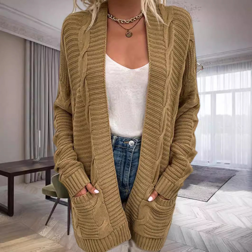 Damernas grovstickad cardigan med strukturerade ärmar och djupa fickor Mirla-Eva Jonsson