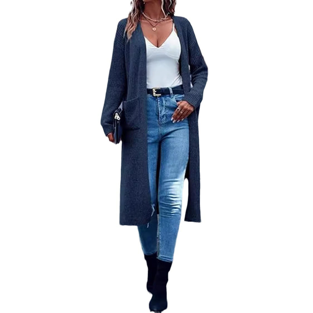 Damernas grovstickad kimono cardigan med djupa fickor och öppna ärmar Mirla-Eva Jonsson