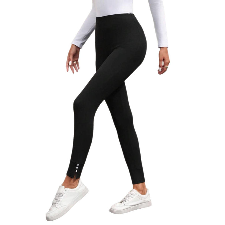 Damernas högmidjade leggings med elegant skärning och knappdetaljer Mirla-Eva Jonsson