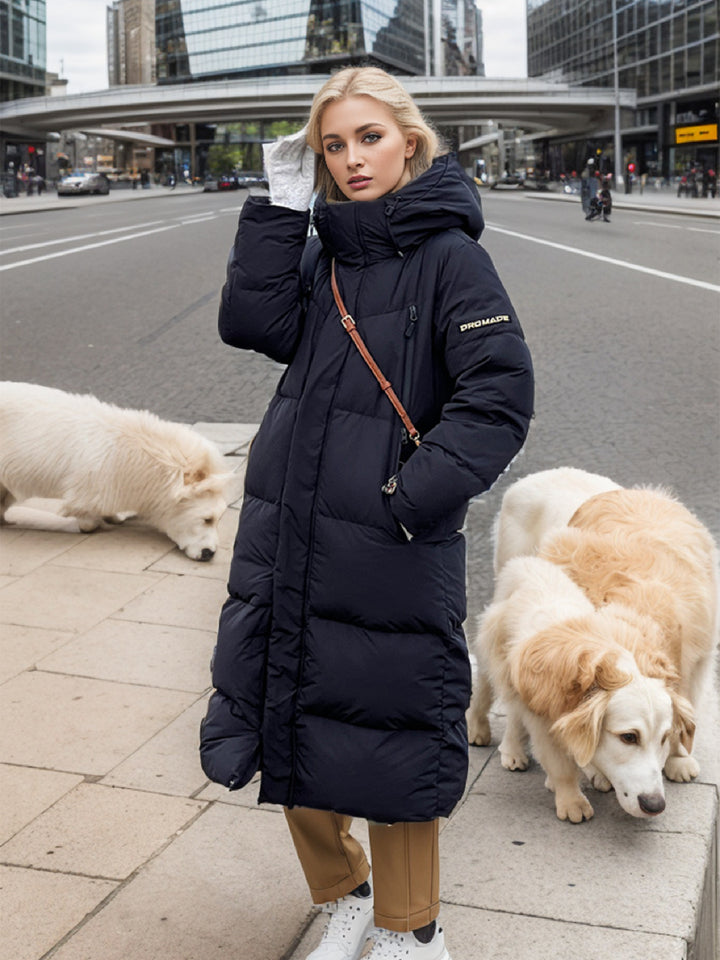 Damernas isolerade lång puffy-kappa med praktisk huva och stilig design Eva Jonsson-Eva Jonsson