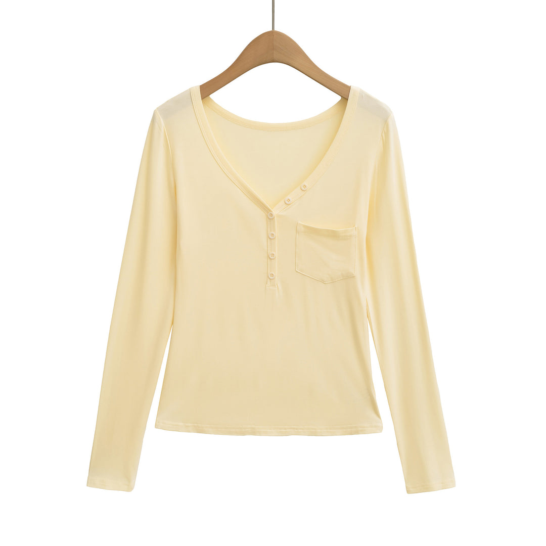 Damernas långärmad basic-t-shirt med knapplist och djup V-urringning Mirla-Eva Jonsson