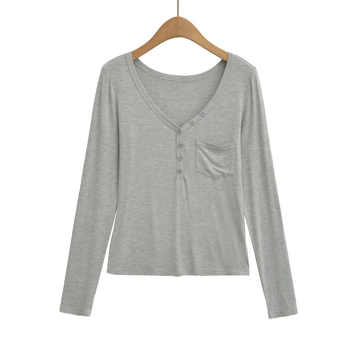 Damernas långärmad basic-t-shirt med knapplist och djup V-urringning Mirla-Eva Jonsson