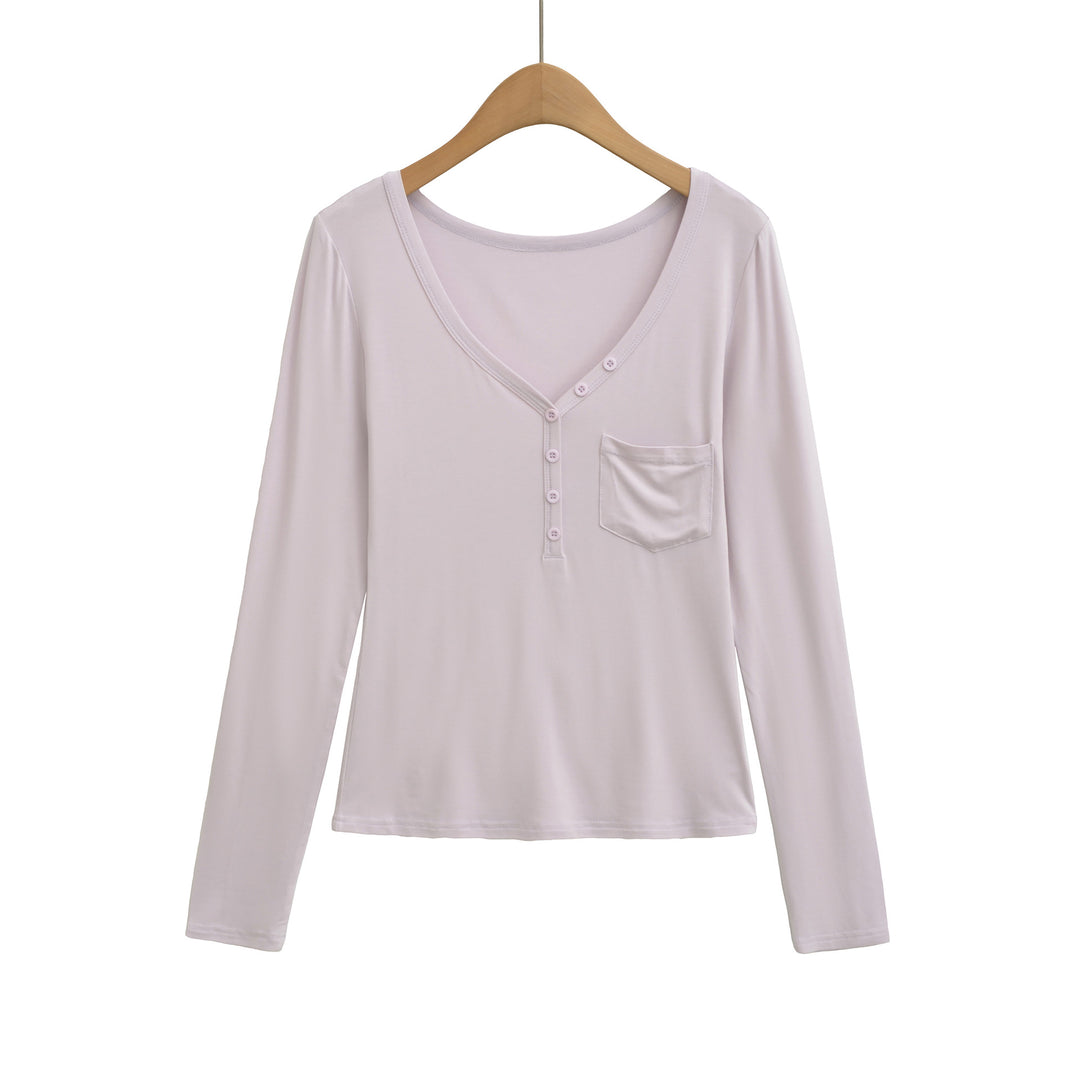 Damernas långärmad basic-t-shirt med knapplist och djup V-urringning Mirla-Eva Jonsson