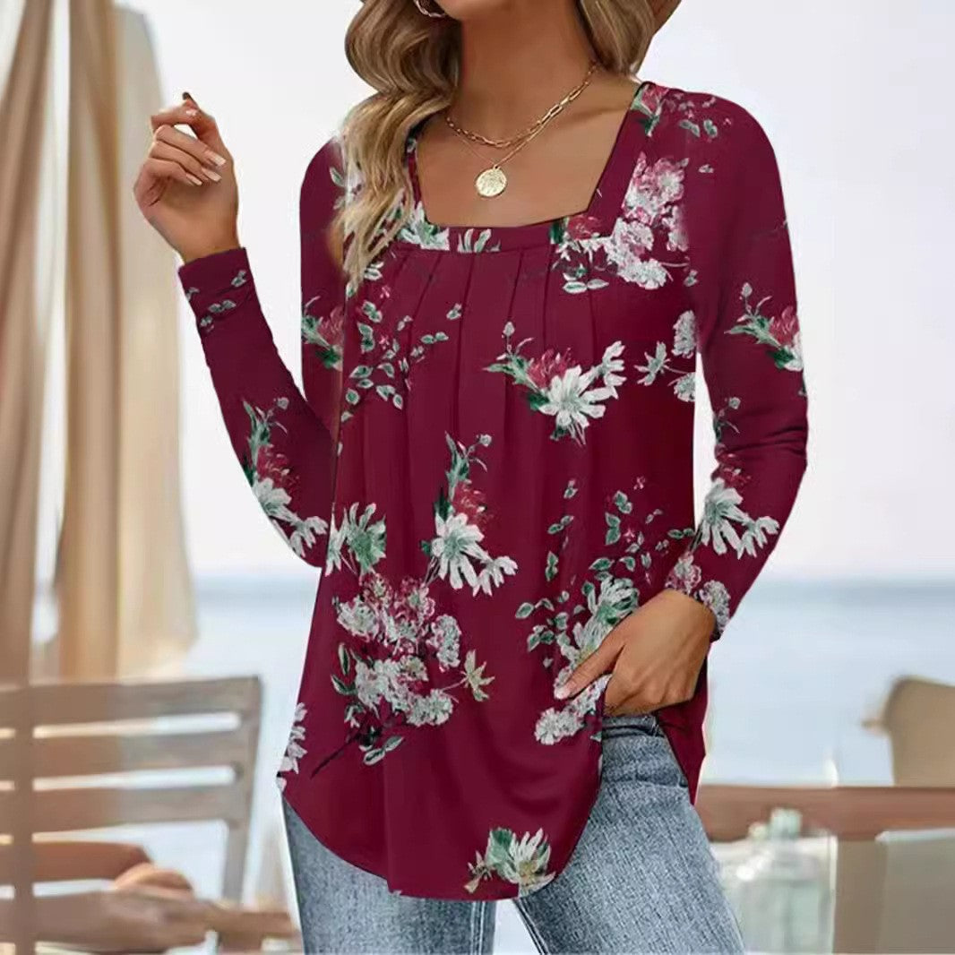Damernas långärmad blus med fyrkantig halsringning och lekfull floral design Mirla-Eva Jonsson