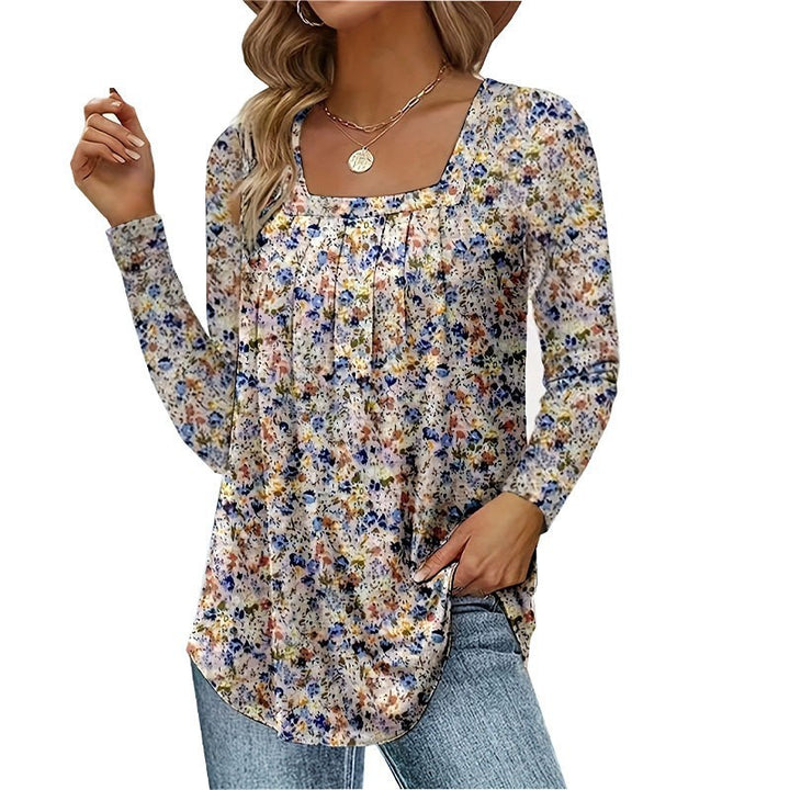 Damernas långärmad blus med fyrkantig halsringning och lekfull floral design Mirla-Eva Jonsson