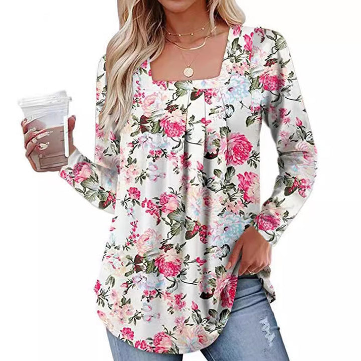 Damernas långärmad blus med fyrkantig halsringning och lekfull floral design Mirla-Eva Jonsson