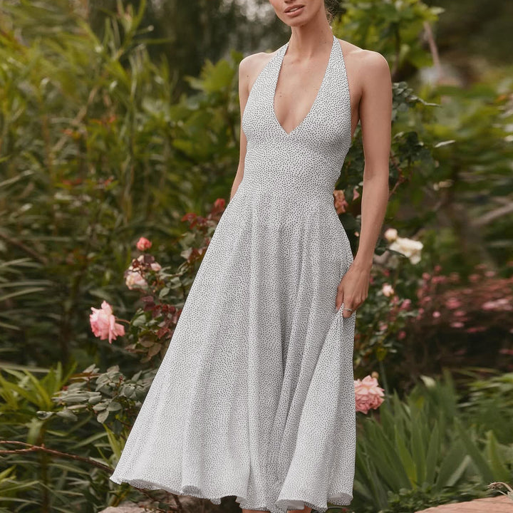 Damernas långärmad maxiklänning med djup V-halsringning och sportig halter Eva Jonsson-Eva Jonsson