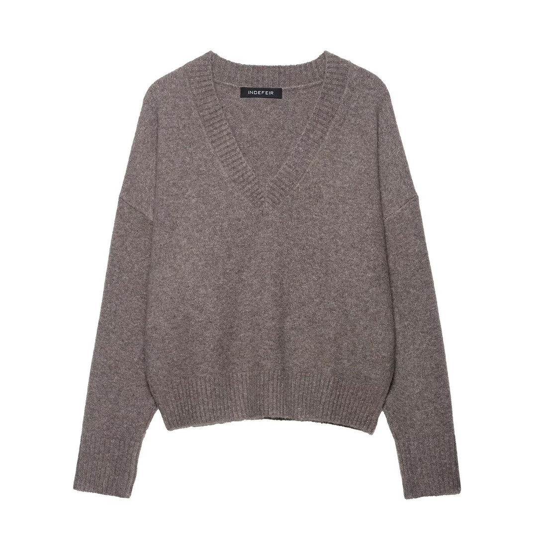 Damernas lockiga stickad tröja med V-ringning och sänkta axlar Eva Jonsson-Eva Jonsson