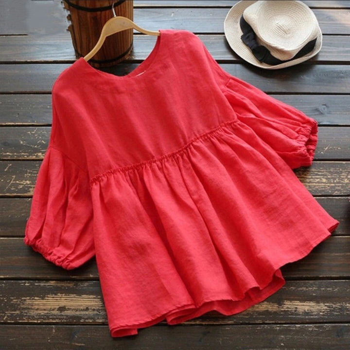 Damernas luftiga tunika med voluminösa ärmar och feminin silhuett Eva Jonsson-Eva Jonsson