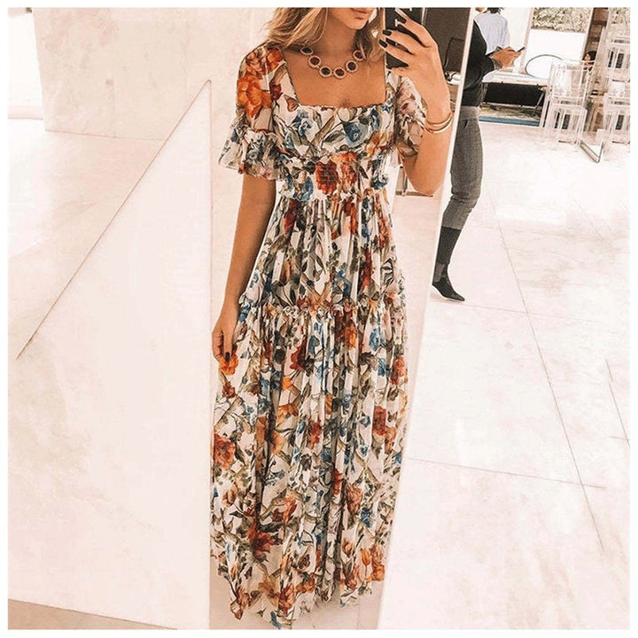 Damernas maxikjol med blommönster och utsvängda ärmar Eva Jonsson-Eva Jonsson