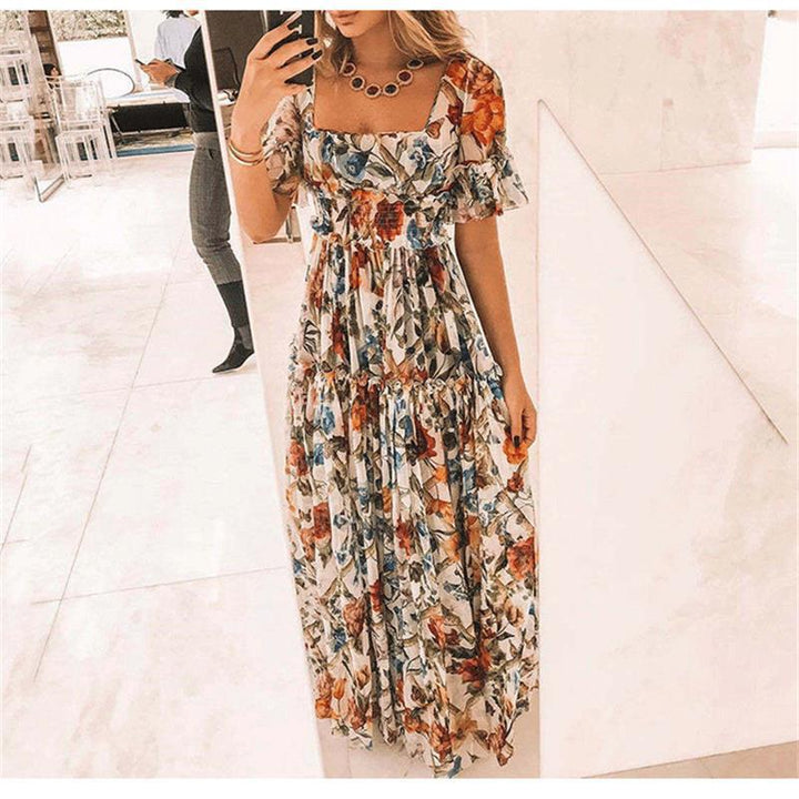 Damernas maxikjol med blommönster och utsvängda ärmar Eva Jonsson-Eva Jonsson