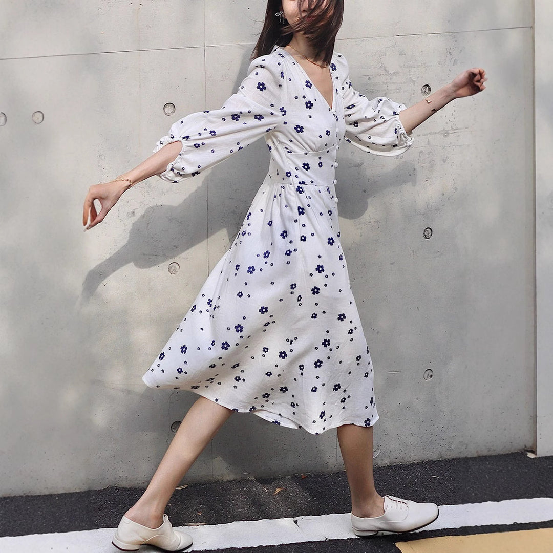 Damernas maxikjol med blomstertryck och eleganta puffärmar Eva Jonsson-Eva Jonsson