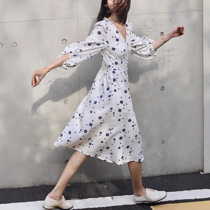 Damernas maxikjol med blomstertryck och eleganta puffärmar Eva Jonsson-Eva Jonsson