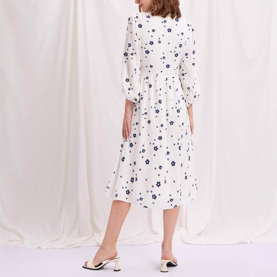 Damernas maxikjol med blomstertryck och eleganta puffärmar Eva Jonsson-Eva Jonsson