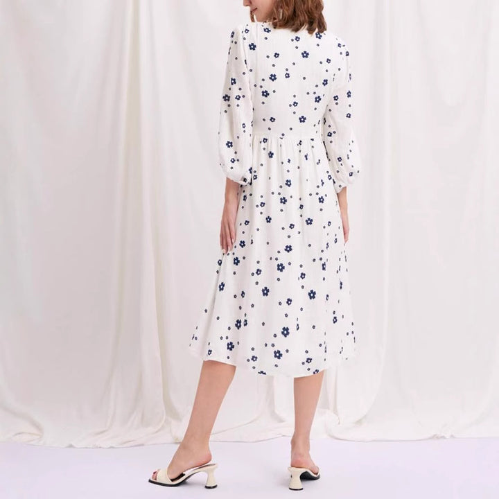 Damernas maxikjol med blomstertryck och eleganta puffärmar Mirla-Eva Jonsson