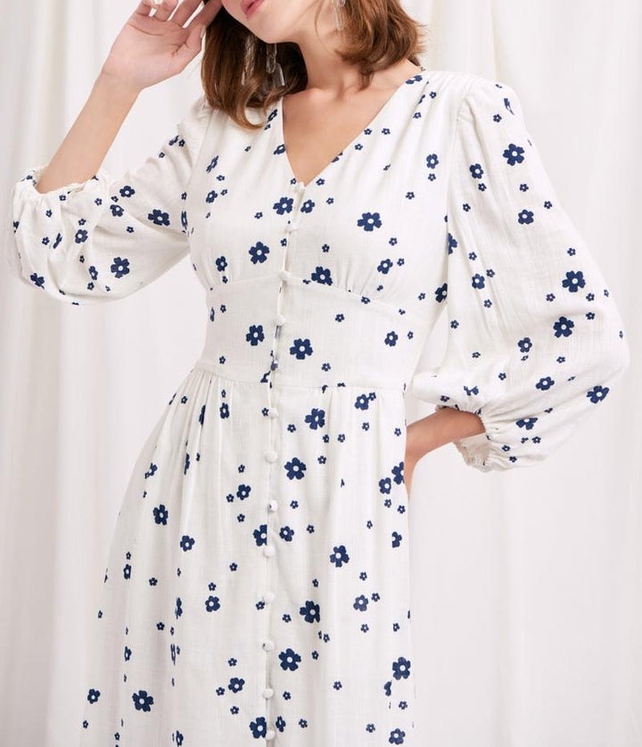 Damernas maxikjol med blomstertryck och eleganta puffärmar Mirla-Eva Jonsson