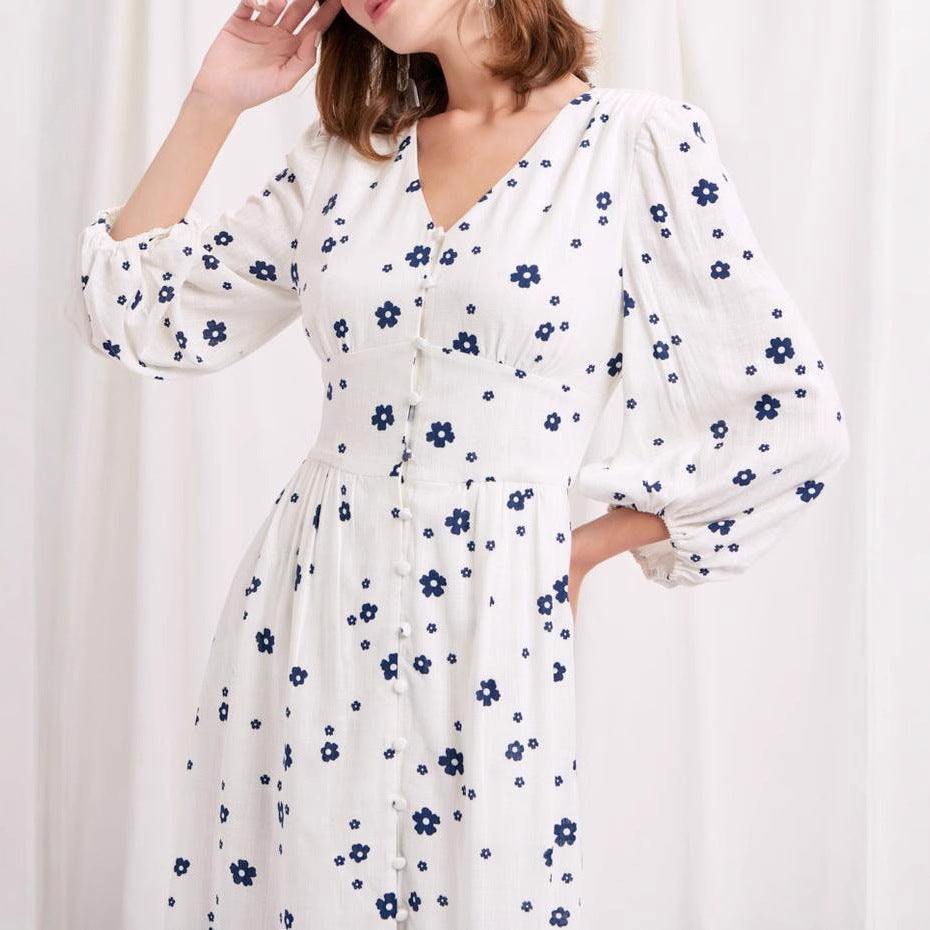 Damernas maxikjol med blomstertryck och eleganta puffärmar Mirla-Eva Jonsson