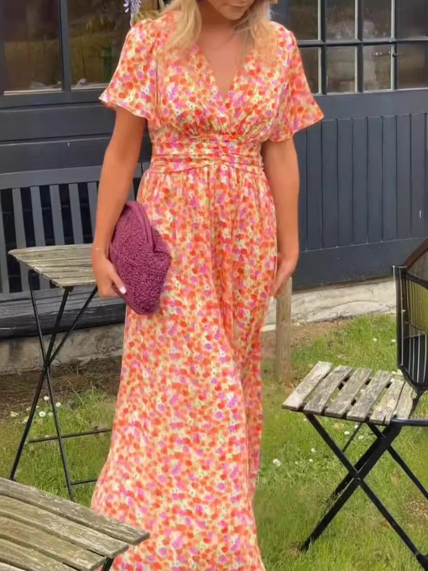 Damernas maxiklädning med floral rynkning och V-ringning Mirla-Eva Jonsson