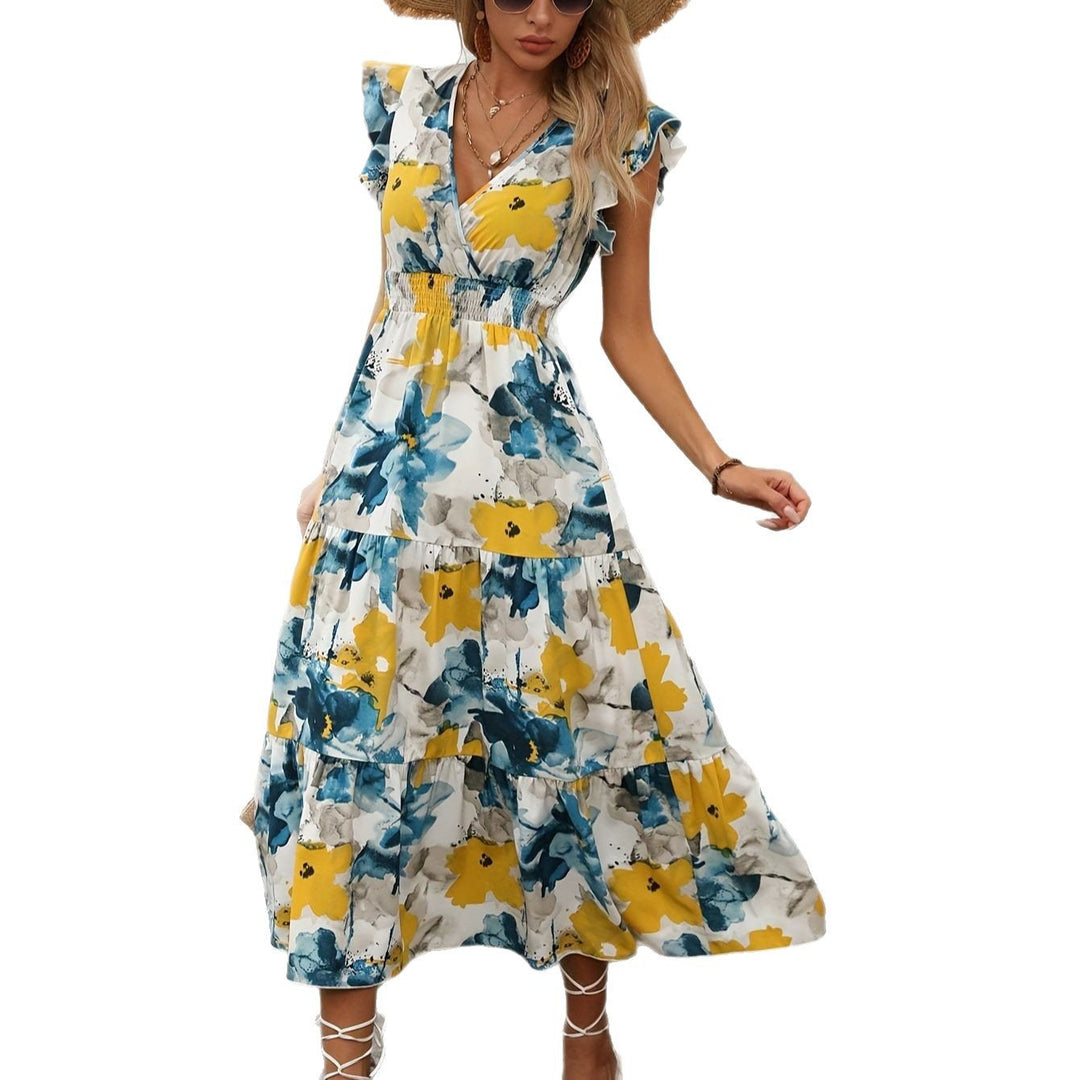 Damernas maxiklänning med blommönster och volangdetaljer Mirla-Eva Jonsson