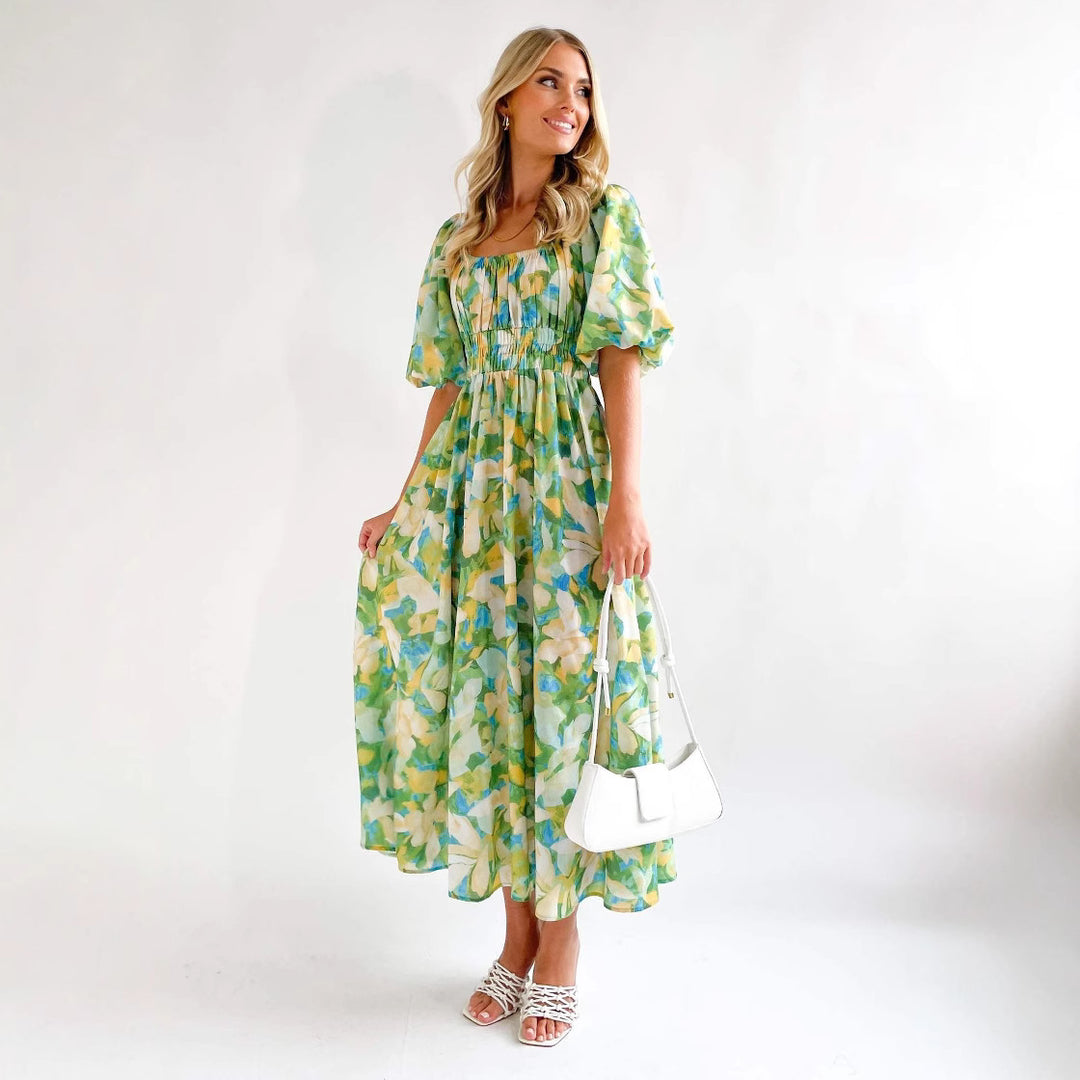 Damernas maxiklänning med luftiga puffärmar och blommönster Mirla-Eva Jonsson