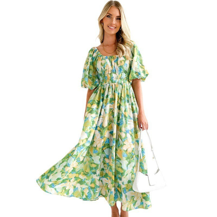 Damernas maxiklänning med luftiga puffärmar och blommönster Mirla-Eva Jonsson