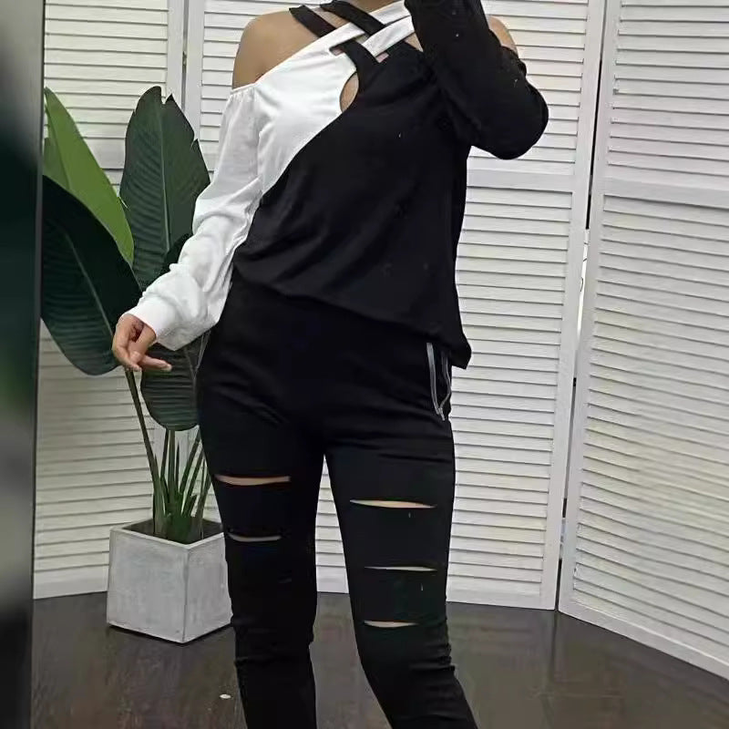Damernas moderna plagg med cut-out-design och asymmetriska ärmar Mirla-Eva Jonsson