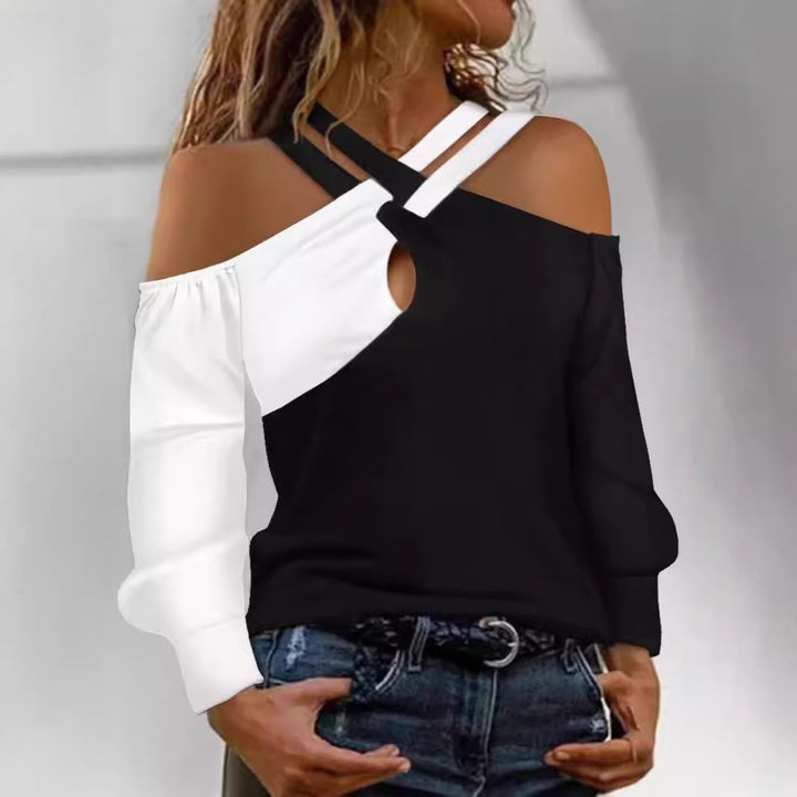 Damernas moderna plagg med cut-out-design och asymmetriska ärmar Mirla-Eva Jonsson