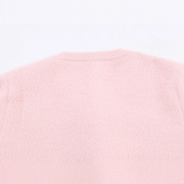 Damernas modetröja med floralt knäppningsdesign Mirla-Eva Jonsson