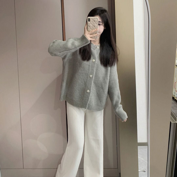Damernas oversized cardigan med stora knapppdetaljer och fin textur Mirla-Eva Jonsson