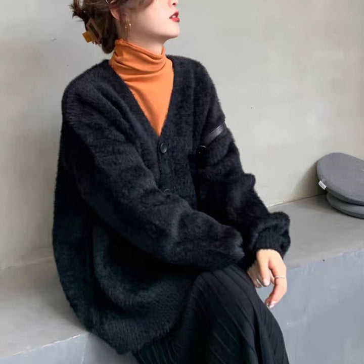 Damernas oversized stickad cardigan med knapppdetaljer Mirla-Eva Jonsson