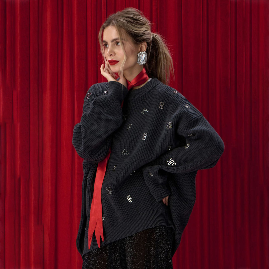 Damernas oversized stickad tröja med glittrande accenter Mirla-Eva Jonsson