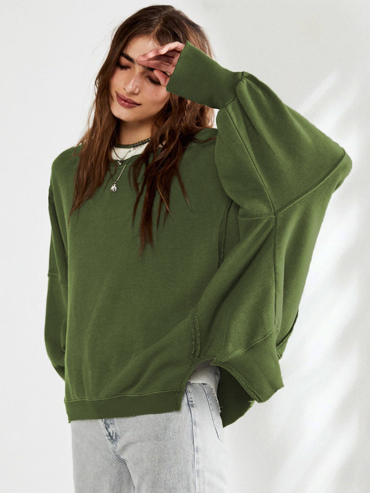 Damernas oversized sweatshirt i avslappnad stil med iögonfallande puffärmar Mirla-Eva Jonsson