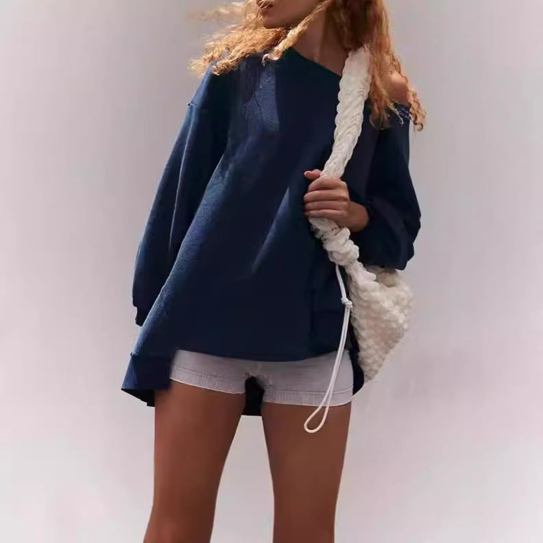 Damernas oversized sweatshirt med avslappnad passform och praktiska fickor Mirla-Eva Jonsson