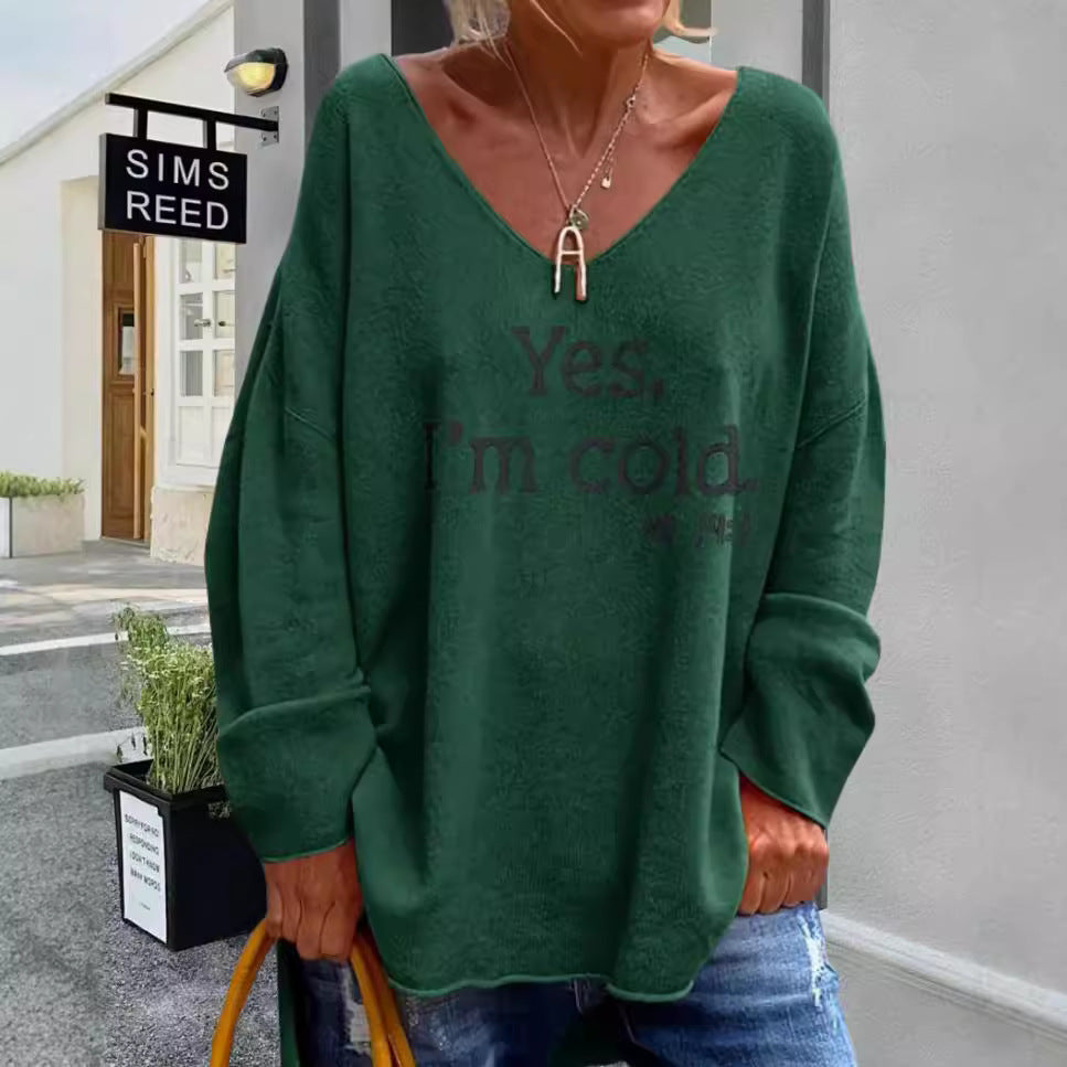 Damernas oversized tröja med modern V-ringning och tryckt uttalande Mirla-Eva Jonsson