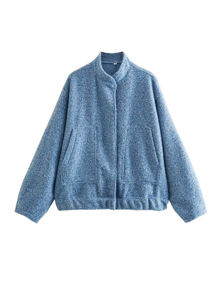 Damernas oversized vinterjacka med hög krage och praktiska fickor Mirla-Eva Jonsson