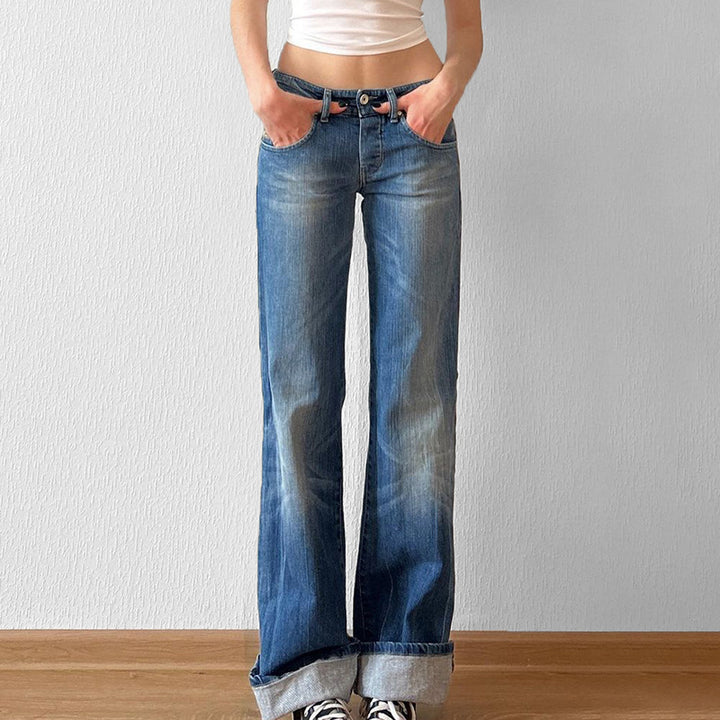 Damernas utsvängda jeans med hög midja och distressed design Mirla-Eva Jonsson
