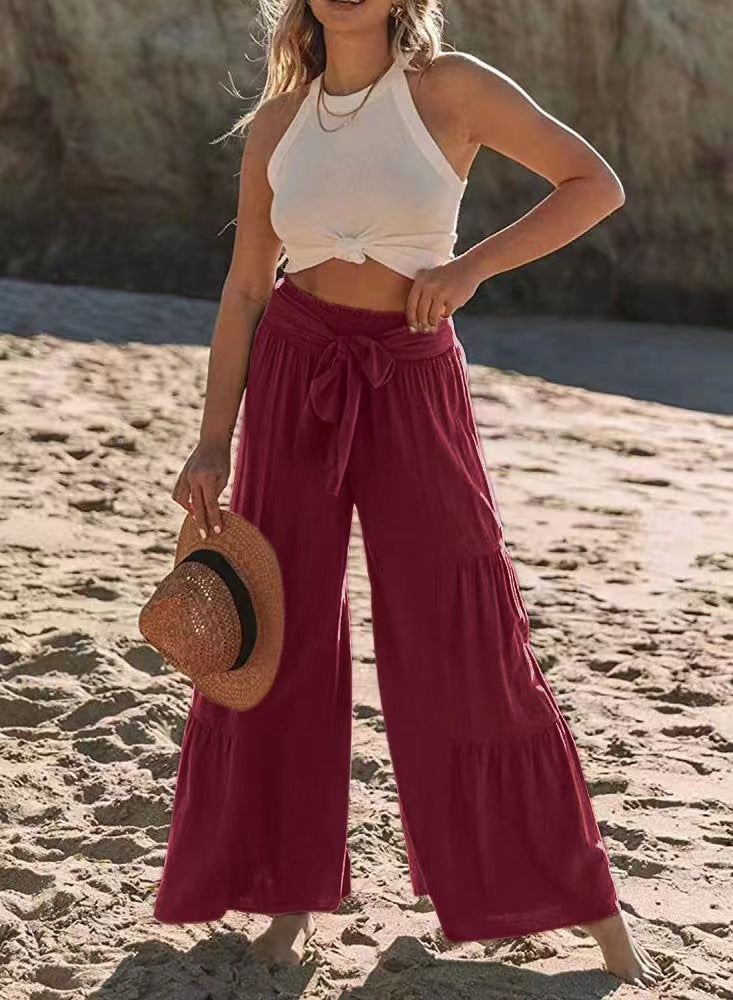 Damernas vida strandbyxor med voluminösa volanger och knytbälte Mirla-Eva Jonsson