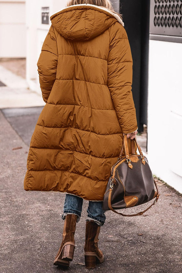 Damernas vinterjacka i avslappnad oversized stil med huva och sidofickor Eva Jonsson-Eva Jonsson