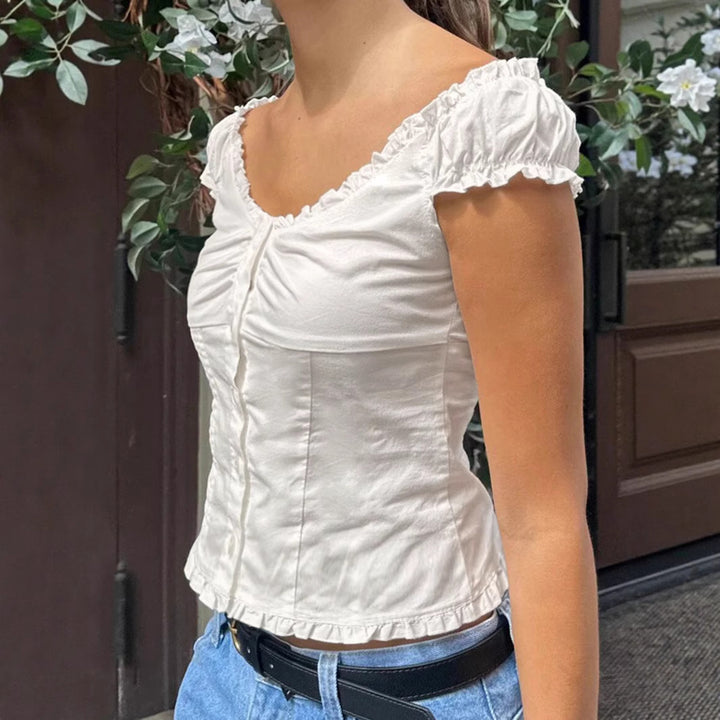 Damernas volang-topp med knappar och figursydd skärning Eva Jonsson-Eva Jonsson
