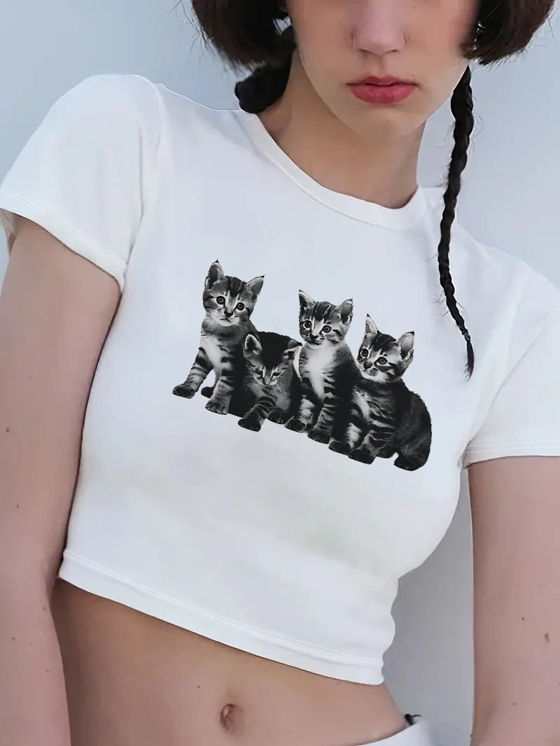 Damers Crop-T-shirt med kreativt motiv och figurnära snitt Mirla-Eva Jonsson