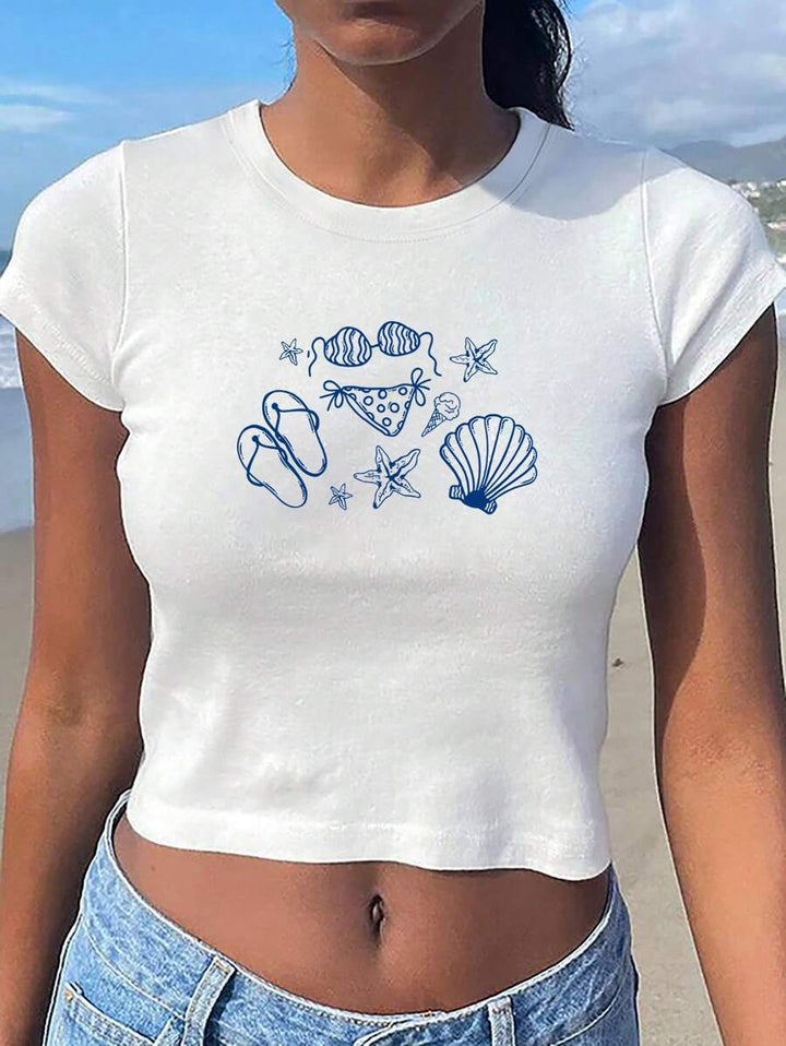 Damers Crop-T-shirt med kreativt motiv och figurnära snitt Mirla-Eva Jonsson