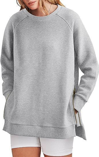 Damers modernt sweatshirt med sidodragkedjor Mirla-Eva Jonsson