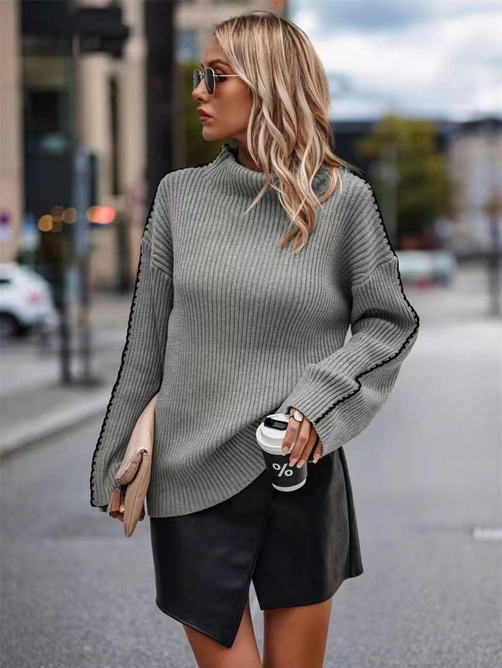 Damers stickad tröja med elegant rullkrage och moderna ärmhål Mirla-Eva Jonsson