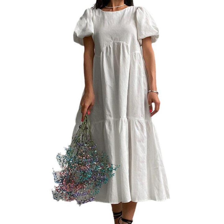 Damh Maxiklänning med voluminösa puffärmar och romantisk design Mirla-Eva Jonsson