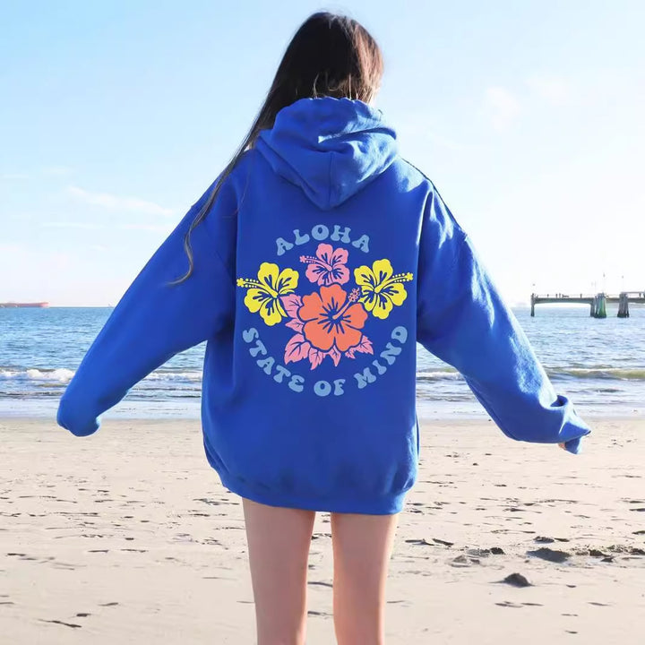 Damhoodie med blommig aloha-design och bekväm passform Mirla-Eva Jonsson