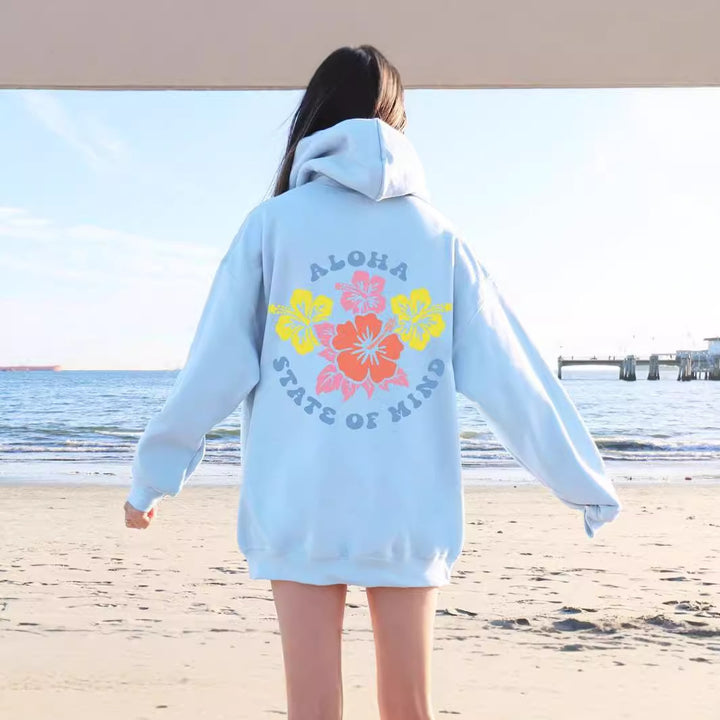 Damhoodie med blommig aloha-design och bekväm passform Mirla-Eva Jonsson