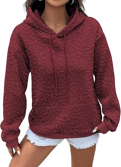 Damhoodie med blommig prägel och generös passform Mirla-Eva Jonsson