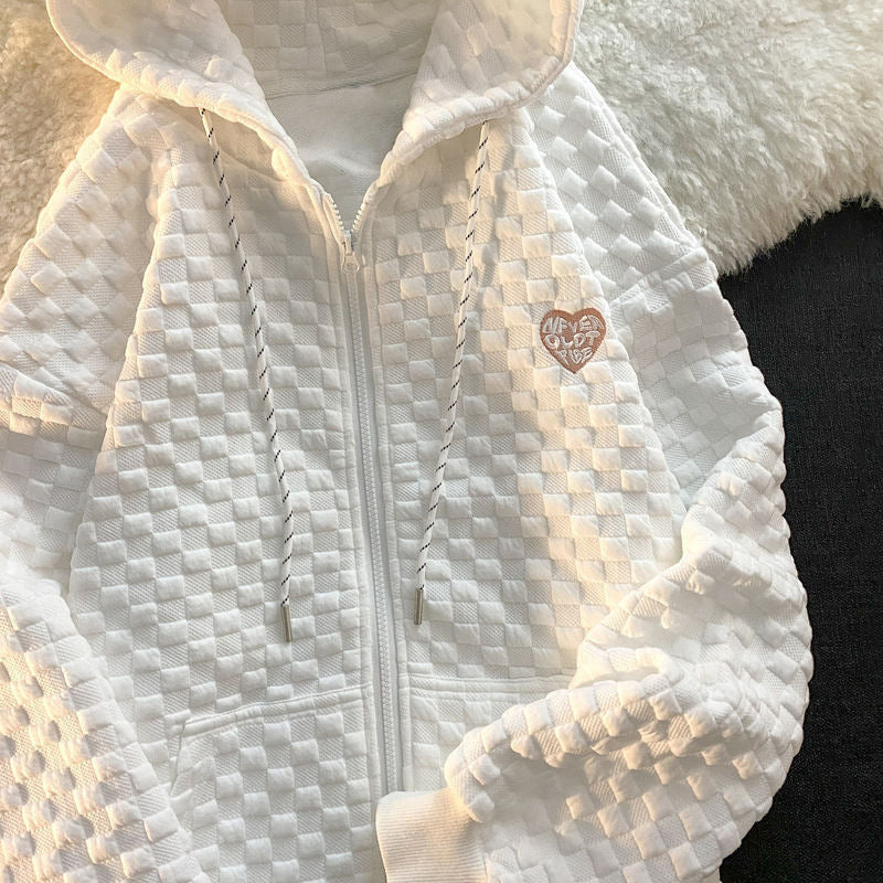 Damhoodiejacka gjord av strukturerat material med praktiska fickor och trendig design-Eva Jonsson