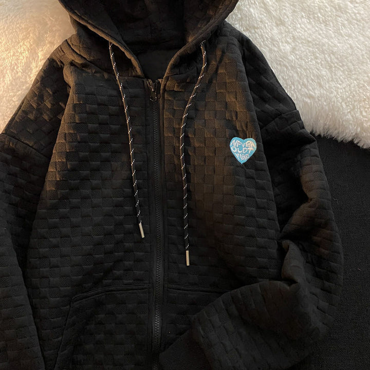 Damhoodiejacka gjord av strukturerat material med praktiska fickor och trendig design-Eva Jonsson